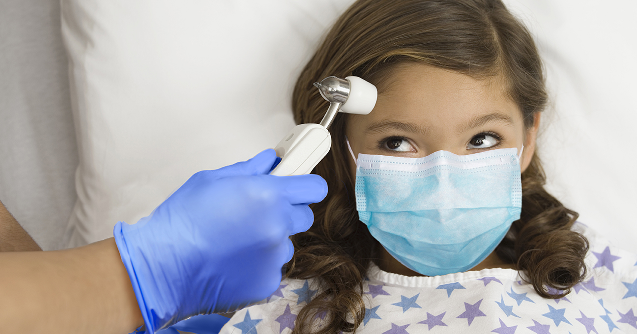 Nurse Taking Little Girl's Temperature